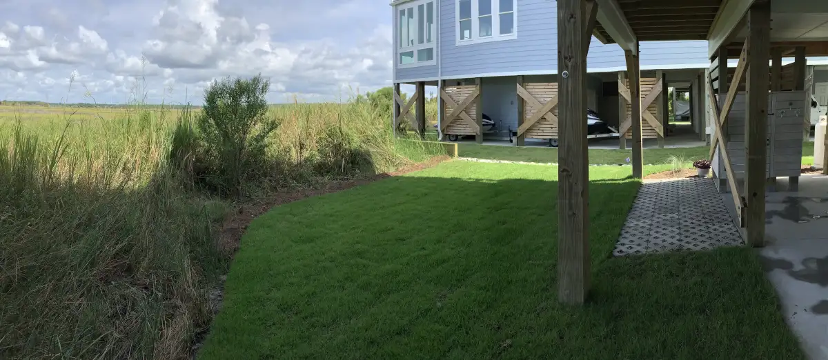 Luxury landscape design for Smithfield NC estate home with paver walkway and designer plantings