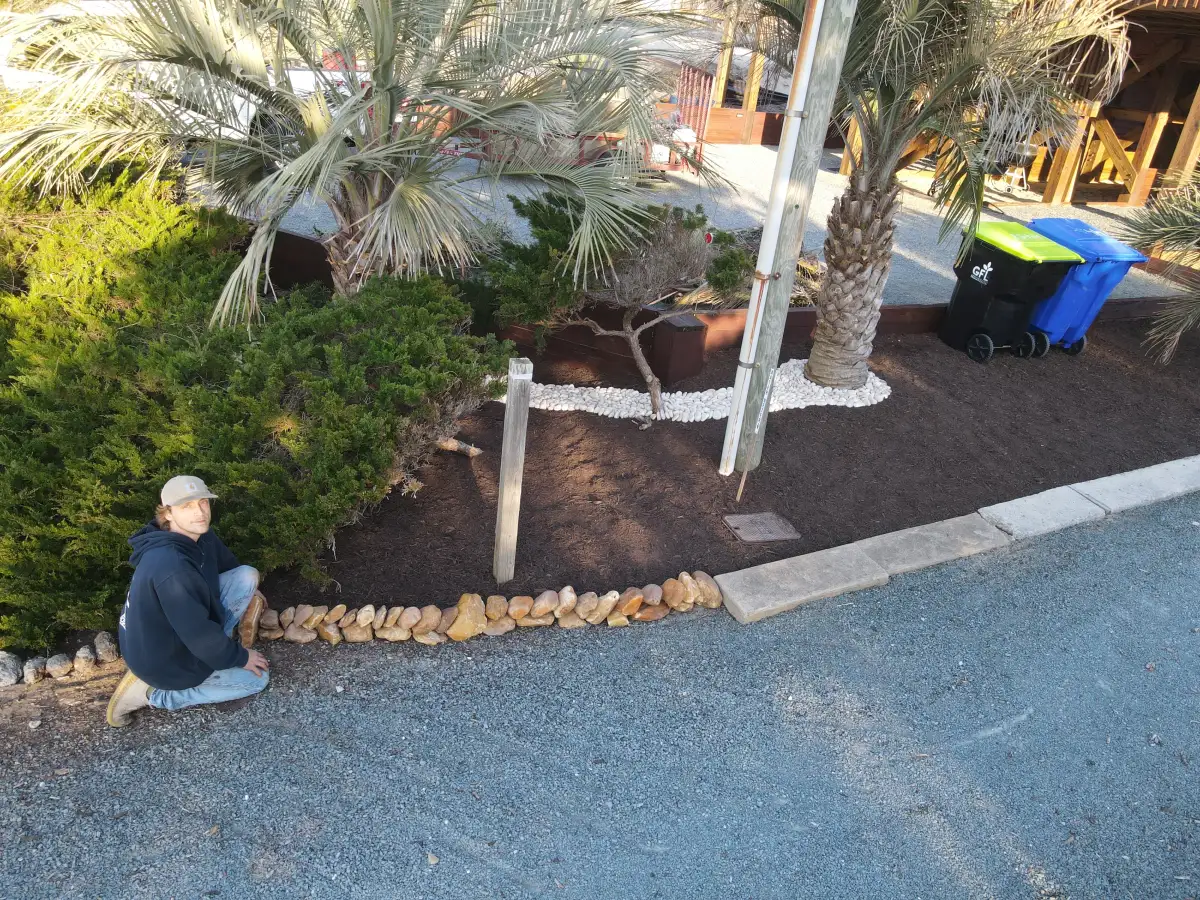 Uplit palms and pathway lighting on a luxury coastal NC property