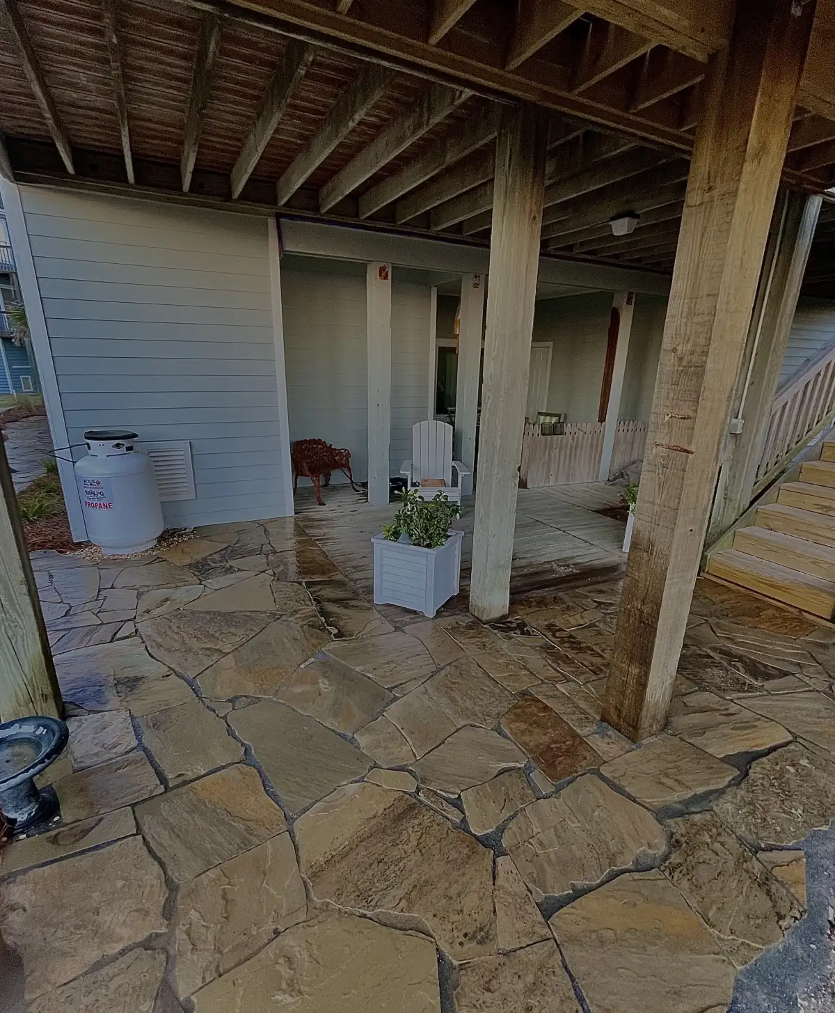 Engineered natural stone retaining wall with terraced landscape in Wilmington NC