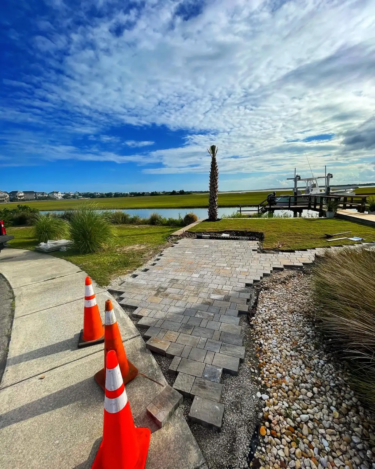 Paver patio installation detail in coastal North Carolina