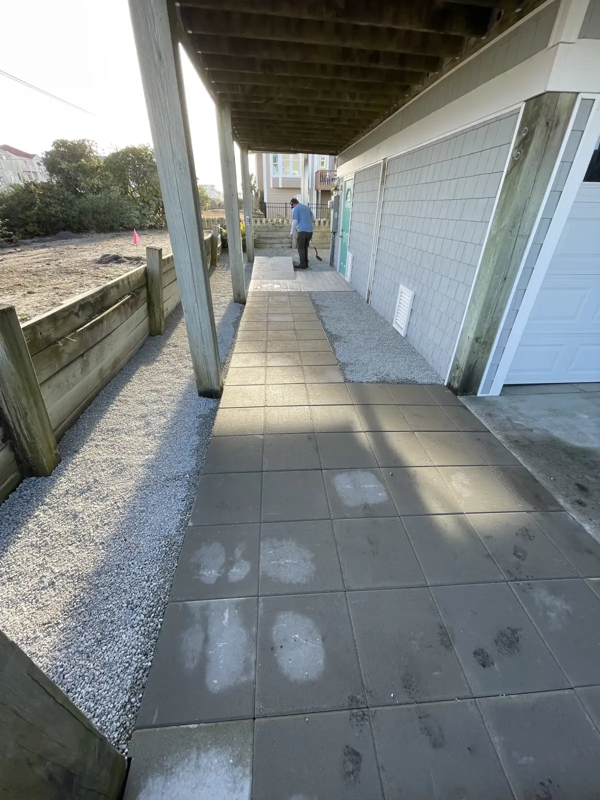 Large paver patio with fire feature and outdoor kitchen in Carolina Beach NC
