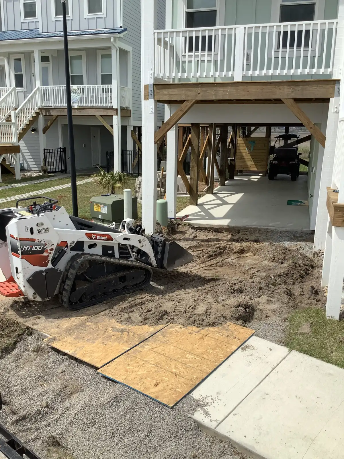 ENC Designs equipment and crew on a luxury outdoor living jobsite in eastern North Carolina